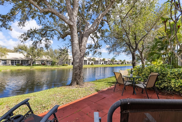 view of patio with a water view