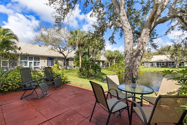 view of patio / terrace with a water view