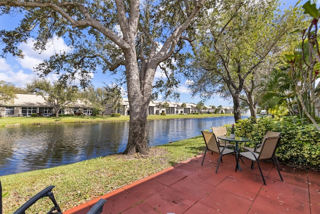 view of patio with a water view