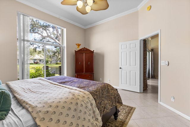 tiled bedroom featuring crown molding and ceiling fan