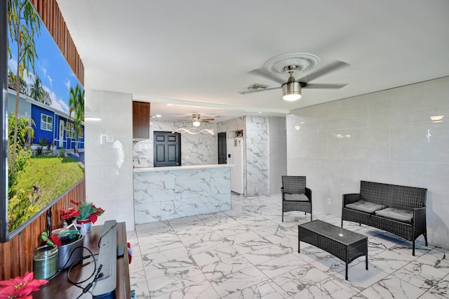 view of patio / terrace featuring ceiling fan, an outdoor living space, and visible vents