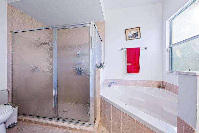 bathroom featuring toilet, independent shower and bath, tile patterned flooring, and a textured ceiling