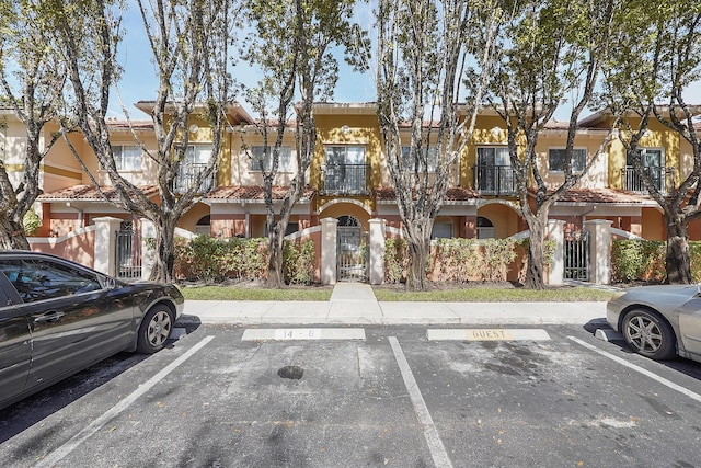 view of property with uncovered parking