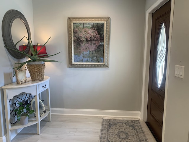 6247 Red Cedar Cir, Greenacres, FL 33463 - kitchen with light stone counters, a kitchen breakfast bar, appliances with stainless steel finishes, a peninsula, and backsplash