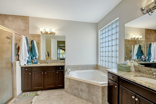 bathroom with vanity, tile patterned floors, and independent shower and bath