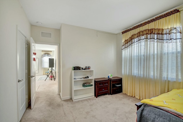 bedroom with light carpet