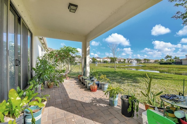 view of patio / terrace with a water view