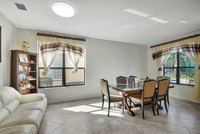 dining space with light tile patterned flooring