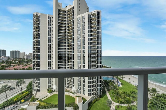 exterior space with a water view and a beach view