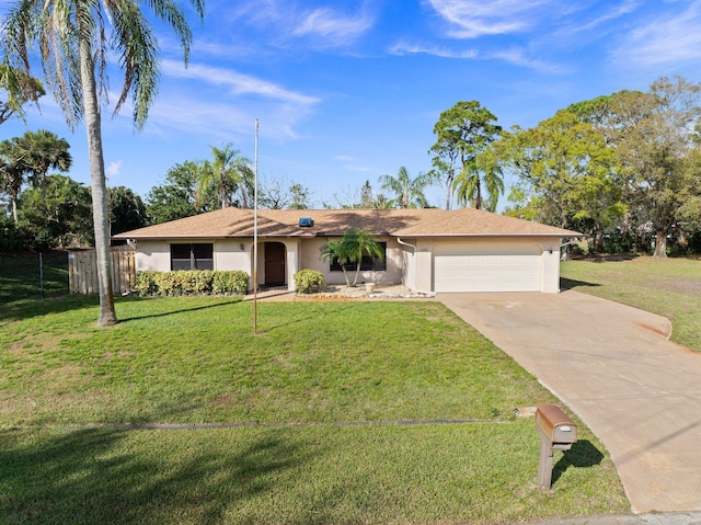 ranch-style home with a garage and a front yard