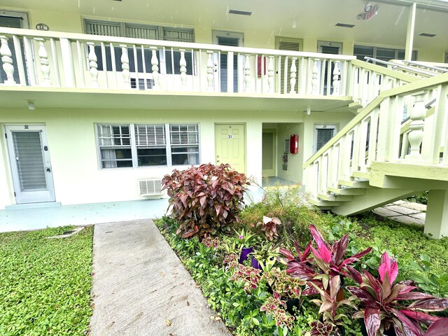 exterior space featuring visible vents and stucco siding