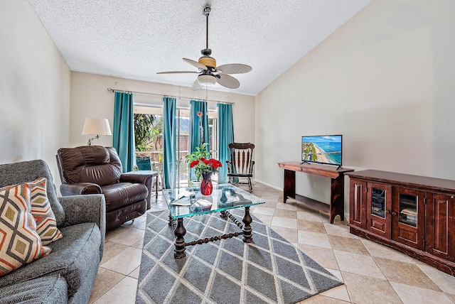 living room with ceiling fan, vaulted ceiling, and a textured ceiling