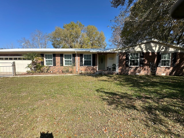 single story home featuring a garage and a front yard