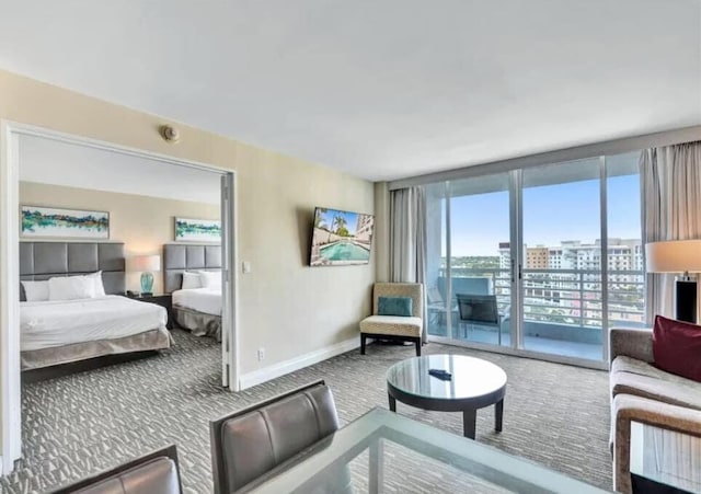 living room featuring carpet floors and floor to ceiling windows