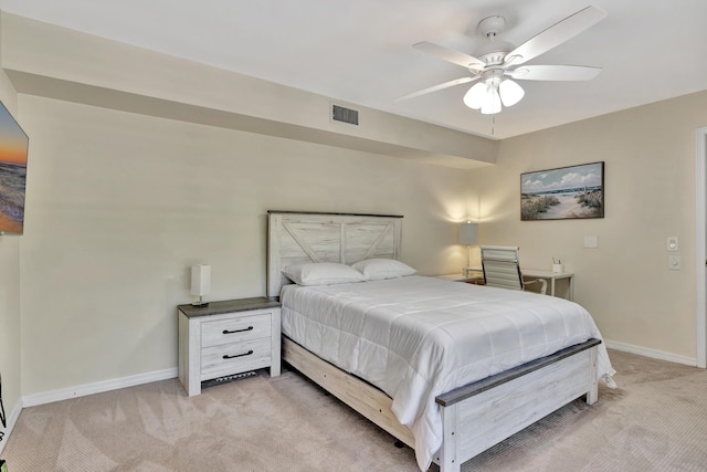 bedroom featuring light colored carpet and ceiling fan