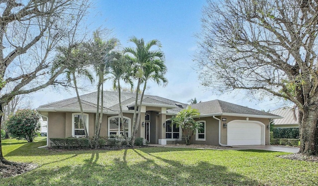 ranch-style house with a garage and a front lawn