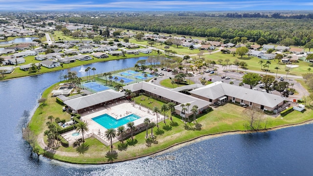 drone / aerial view featuring a water view and a residential view