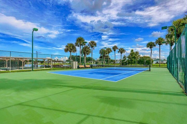 view of sport court with fence