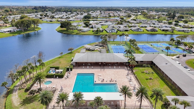 drone / aerial view with a residential view and a water view