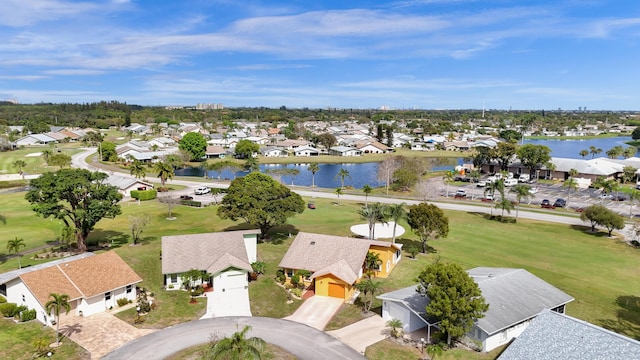 birds eye view of property with a water view and a residential view