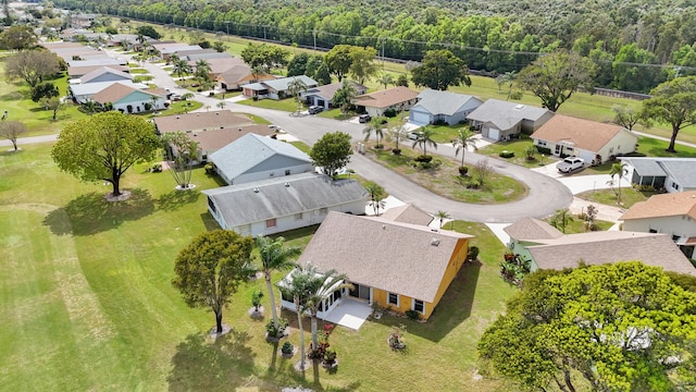 birds eye view of property with a residential view and a wooded view