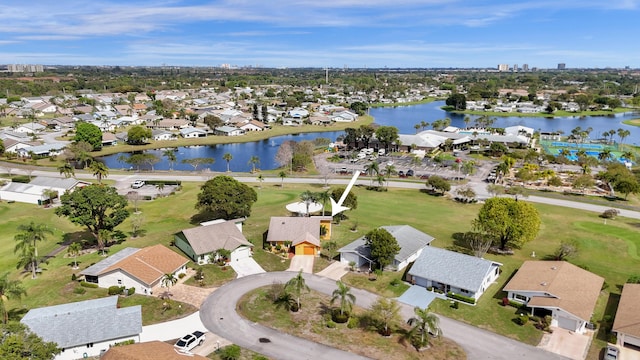 bird's eye view with a water view and a residential view