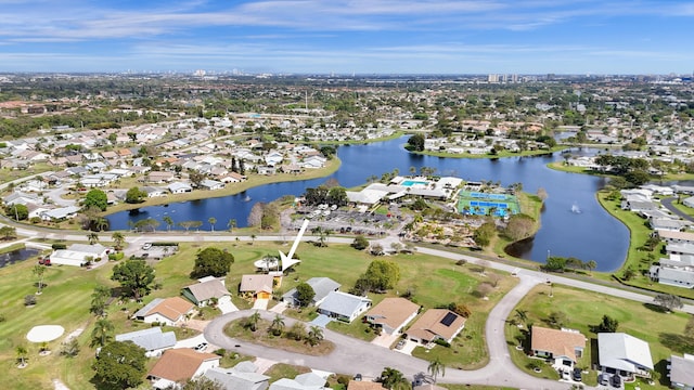 birds eye view of property featuring a residential view and a water view