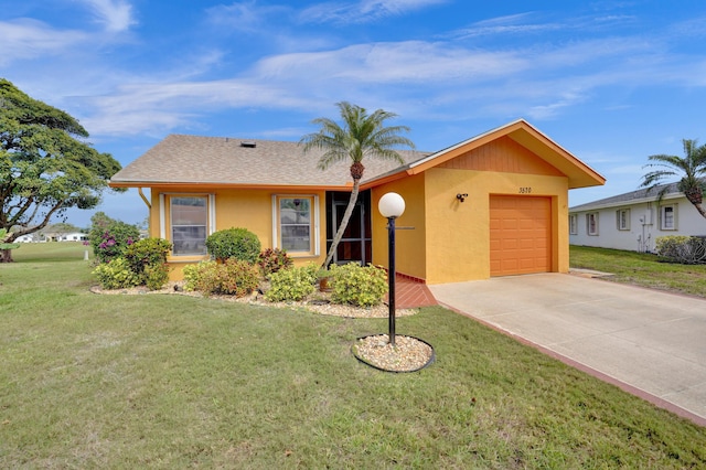 single story home with stucco siding, a front lawn, concrete driveway, and a garage