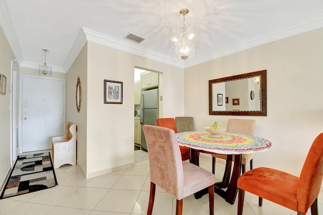 dining room featuring light tile patterned floors, crown molding, and a notable chandelier