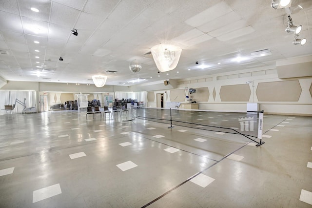 workout area with a drop ceiling