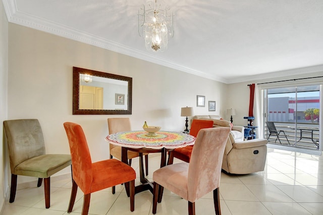 tiled dining space featuring ornamental molding and a chandelier