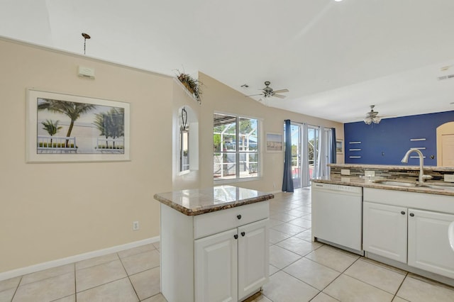 kitchen featuring sink, white cabinetry, white dishwasher, a kitchen island, and ceiling fan