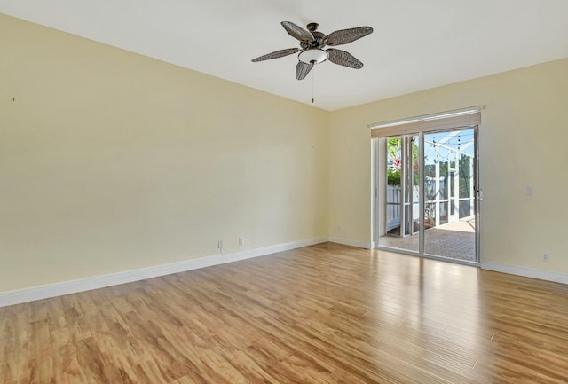 empty room featuring ceiling fan and light hardwood / wood-style flooring