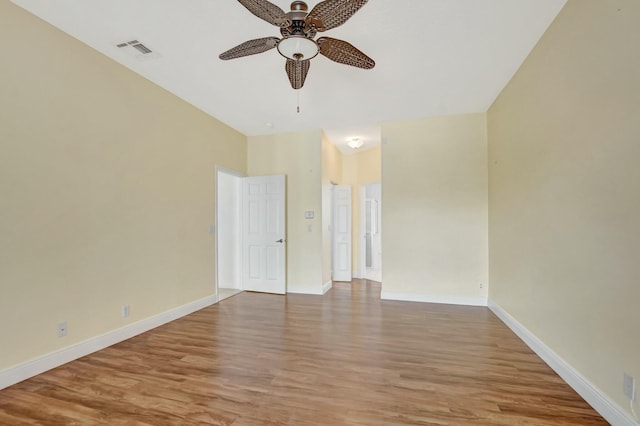 unfurnished room featuring ceiling fan and light hardwood / wood-style flooring