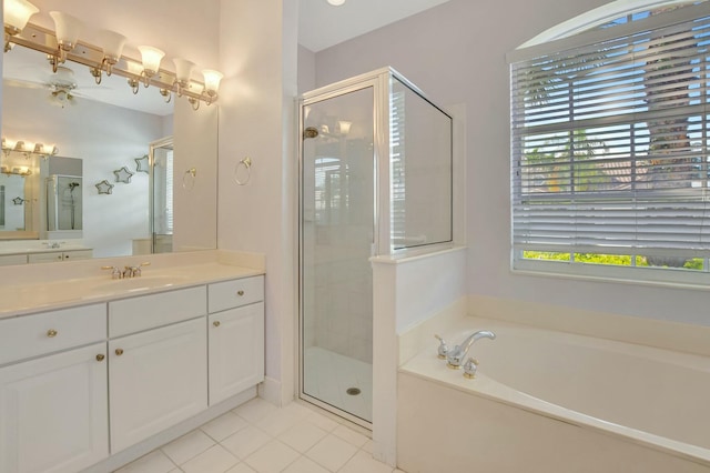 bathroom featuring tile patterned flooring, vanity, and independent shower and bath