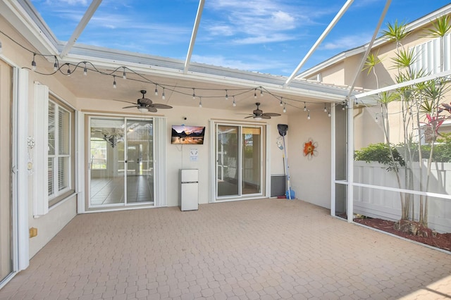 view of patio / terrace featuring track lighting and ceiling fan