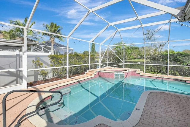 view of pool featuring a water view, an in ground hot tub, a lanai, and a patio