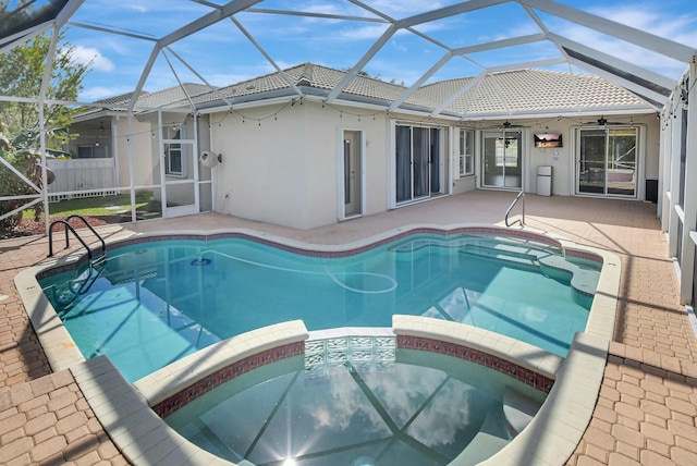 view of pool featuring a patio, a lanai, and ceiling fan