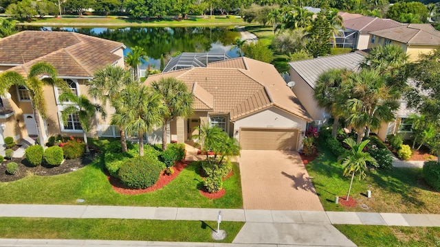 birds eye view of property with a water view