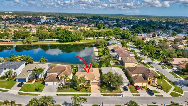 birds eye view of property featuring a water view