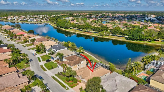 birds eye view of property with a water view