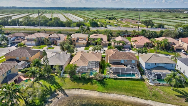 birds eye view of property with a rural view