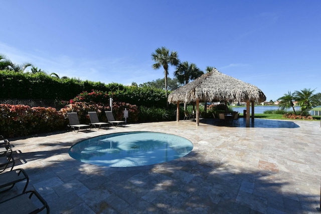 view of swimming pool with a gazebo and a patio area