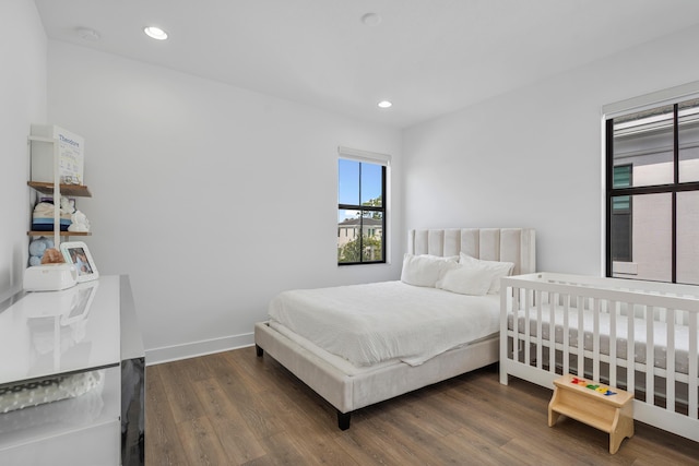 bedroom featuring dark wood-type flooring