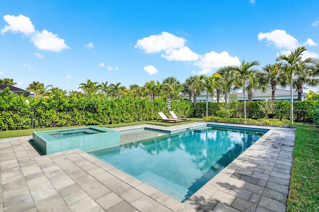 view of pool with an in ground hot tub and a patio area