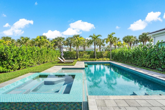 view of pool featuring an in ground hot tub