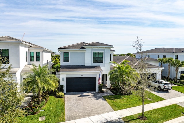 view of front facade with a garage and a front yard