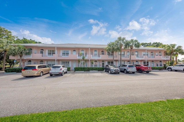 view of property featuring uncovered parking