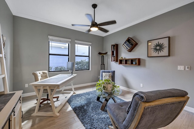 office space with ceiling fan, ornamental molding, and light hardwood / wood-style flooring