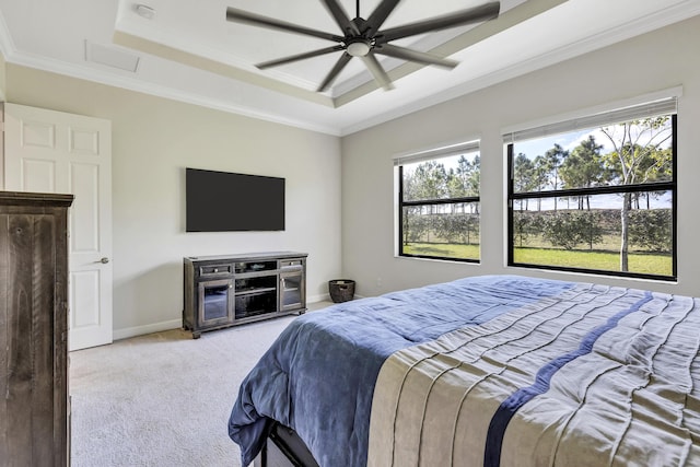 bedroom featuring crown molding, light colored carpet, a raised ceiling, and ceiling fan